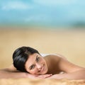 Long haired girl in bikini laying and tanning Royalty Free Stock Photo