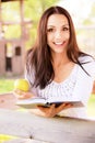 Long-haired girl reads book