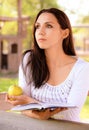 Long-haired girl reads book