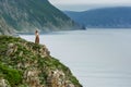 Long-haired girl on sea shore Royalty Free Stock Photo