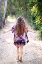 Long haired girl walking with outstretched arms Royalty Free Stock Photo