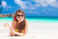 Long haired woman with flower in hair in bikini on tropical beach Royalty Free Stock Photo