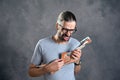 Long haired young man with cardboard guitar Royalty Free Stock Photo