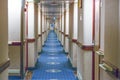 Long hallway on the ship. Rows of cabin doors. Long corridor leading to rooms. Royalty Free Stock Photo