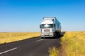 Long Haul overnight Trucking Logistics on a country highway road in South African Farmland region