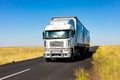 Long Haul overnight Trucking Logistics on a country highway road in South African Farmland region