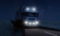 Long Haul overnight Trucking Logistics on a dark country highway road Royalty Free Stock Photo