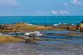 Waves at turquoise water on sandy ocean or sea beach Royalty Free Stock Photo