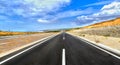Long highway crossing sunny desert Royalty Free Stock Photo