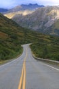 Long highway winding its way down hill Royalty Free Stock Photo