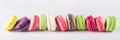 Long horizontal row of colorful bright biscuits Royalty Free Stock Photo