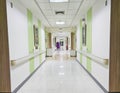 Long hospital bright corridor with rooms. Empty modern hospital corridor Royalty Free Stock Photo