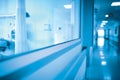 Long hospital hallway with observation window to the ward