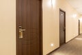 Long hotel corridor accent on the door Royalty Free Stock Photo