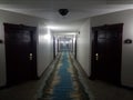 Long hotel hallway corridor or hall with doors