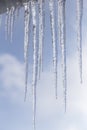 Long icicles of ice on the roof of the house