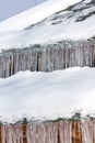 Long icicles on the roof. Icing at home.