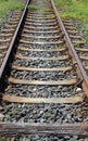 long iron train rail tracks to infinity with no people Royalty Free Stock Photo