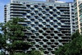 Abstract geometric pattern formed by balconies on a modern high-rise apartment building