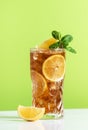 Long Island ice tea cocktail with vodka, rum, tequila, gin, liquor, lemon juice, cola and ice, garnished with lemon slice and mint Royalty Free Stock Photo