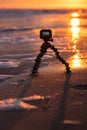 Long Island, New York - January 6, 2020 : A GoPro action camera capturing a time lapse video of a beautiful sunset on a beach