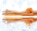 Long legs of relaxed lady with orange towel Royalty Free Stock Photo