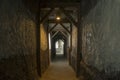 Long lighten tunnel through gypsum mine with wooden beams in north of Thailand Royalty Free Stock Photo