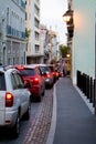 Long line of cars on narrow street in San Juan Puerto Rico