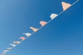 A long line of flags is hanging in the sky Royalty Free Stock Photo
