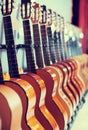 Long line of new acoustic guitars in store Royalty Free Stock Photo