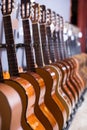 Long line of new acoustic guitars in store Royalty Free Stock Photo