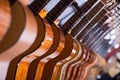 Long line of new acoustic guitars in store Royalty Free Stock Photo