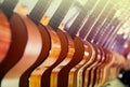 Long line of new acoustic guitars in store Royalty Free Stock Photo