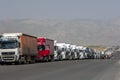 A long line of semi-trailers and trucks wait on the Turkish border with Iran.