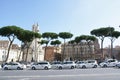 A long line of white taxis waiting for tourists in Rome