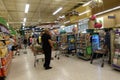 The long lines at typical grocery with carts filled with food and disinfectant cleaning supplies at a Publix grocery store