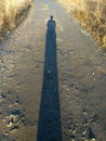 Long-long human shadow at sunset