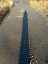 Long-long human shadow at sunset