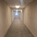 Long motel hallways carpet beige