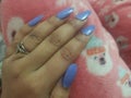 Long nail with blue nailpaint Royalty Free Stock Photo