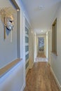 Long, narrow corridor with decorative wall mask