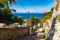 Long narrow path full of small red brick steps down to bay of Capri Royalty Free Stock Photo