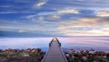 Long narrow pier protruding out into Chesapeake Bay at sunset under a magnificent sky Royalty Free Stock Photo