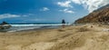 Long natural beach Benijo with footprints in the sand. Lava rock in the water. Blue sea horizon, natural sky background Royalty Free Stock Photo