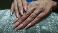 Long natural looking manecured nails white hands