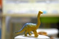 Long neck tall Dinosaur toy figure on blur background Royalty Free Stock Photo