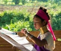 Long neck tribe woman weaving