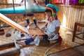 Long necked Kayan Padaung woman weaving