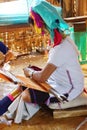 Long necked Kayan Padaung woman weaving