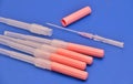 Long Needles used for puncturing artery or vein secured with cap. Royalty Free Stock Photo